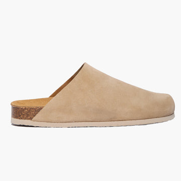 Tan  suede clog shoe without straps on a white background